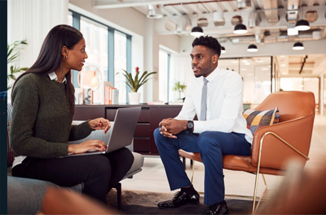 Two people talking about grief in the workplace