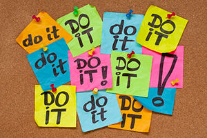 a bulletin board with notes that say do it