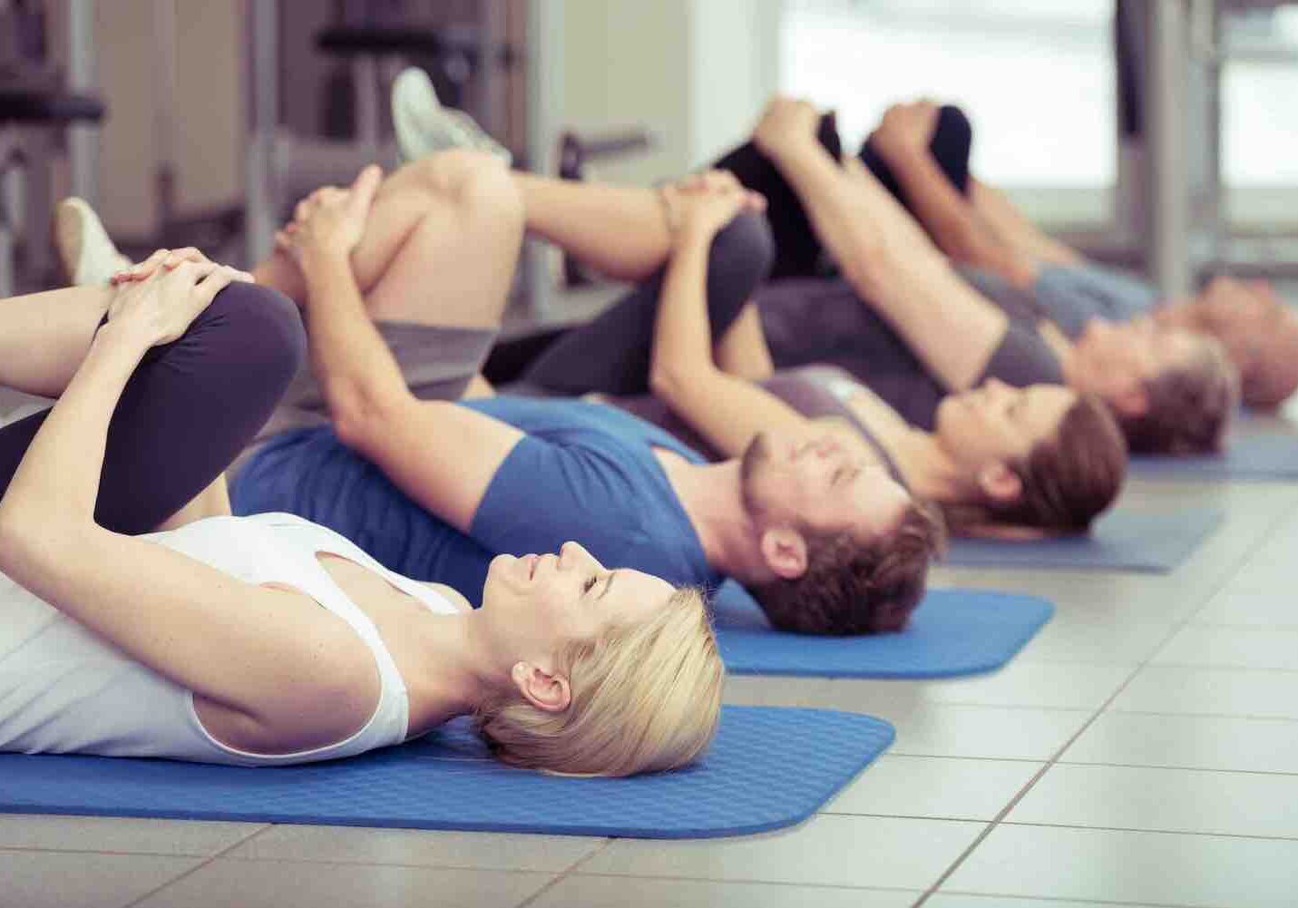 Gentle Yoga Stretch Group of people gentle yoga stretching.